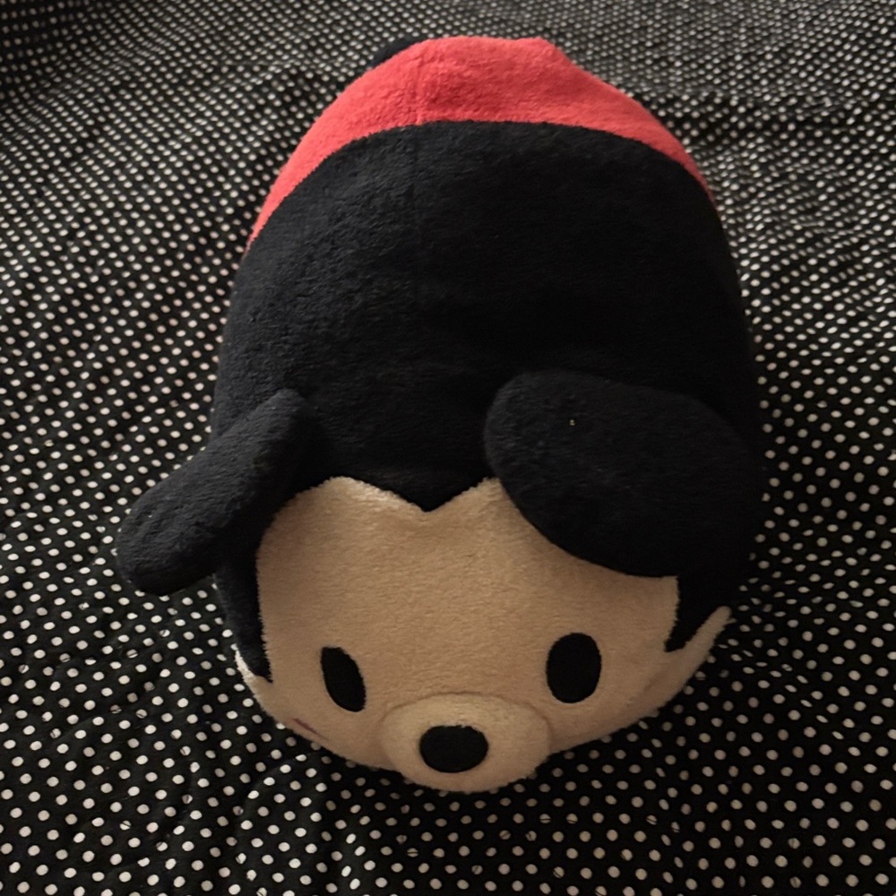 Mickey Mouse Tsum Tsum approximately 14” by 9”.